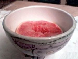 A pink grapefruit with sugar.
