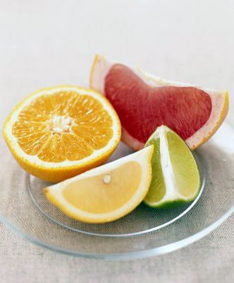 Wedges of pink grapefruit, lime, and lemon, an...